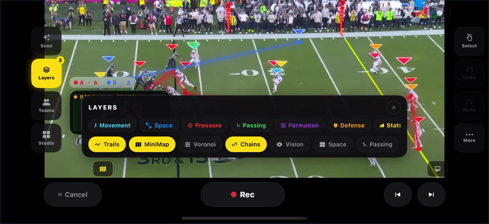 The Layers panel open over a frozen football frame with movement, space, pressure, passing, formation, defense and stats toggles
